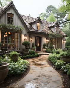 a house that is surrounded by trees and plants