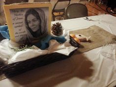 the table is set up with pine cones and other items