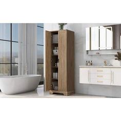 a white bath tub sitting next to a wooden cabinet