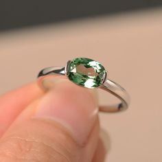 This is a gorgeous handmade creation. Its beauty is its simplicity & Elegance. The 6*8mm round cut lab green sapphire is crafted in solid sterling silver and with rhodium plated. All item is sent in a beautiful gift box You can realize more lovely stuff clicking the link https://www.etsy.com/shop/knightjewelry?refshopsection_shophome_leftnav Please leave the correct address and you phone number for delivering successfully. Green Oval Sapphire Promise Ring, Classic Oval Green Sapphire Ring, Classic Green Sapphire Oval Ring, Classic Green Oval Sapphire Ring, Green Sapphire Ring For May Birthstone In Sterling Silver, Green Sapphire Sterling Silver Ring For May Birthstone, Green Sapphire Ring Sterling Silver, May Birthstone, Green Oval Sapphire Ring For Anniversary, Oval Green Sapphire Ring For Anniversary