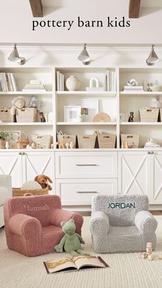 a room with white walls and shelves filled with books, toys and stuffed animals on the floor