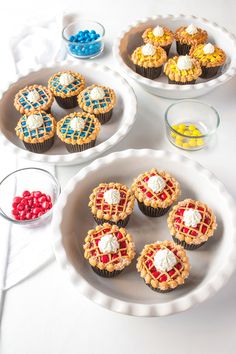 several desserts are arranged in bowls on a table