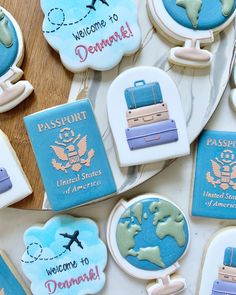 decorated cookies with travel related items on them