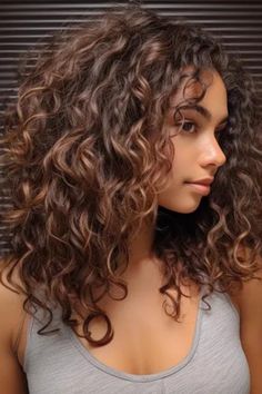 Soft spiral curls for that chocolate-brown romantic vibe. It is a hairstyle that gives your chocolate brown hair a glamorous look, ideal for an event or even during the night. Click here to check out more stunning chocolate brown hair color ideas to try this year. Biracial Hair Highlights, Chocolate Brown Hair With Chestnut Highlights, Curly Hair Color For Brown Skin, Curly Chestnut Hair, Julie Roberts Hair, Chocolate Hair Color Curly, Chocolate Curly Hair Color, Curly Hair Summer Color, Honey Highlights On Brown Hair Curly