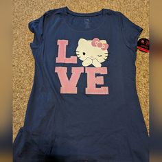 Smoke Free Home Blue Hello Kitty Print Short Sleeve Top, Blue Short Sleeve Top With Hello Kitty Print, Casual Pink T-shirt With Cat Design, Blue Casual T-shirt With Cat Print, Casual Blue T-shirt With Cat Print, Hello Kitty Tshirt, Hello Kitty Shirt, Hello Kitty Pink, Cat Shirts