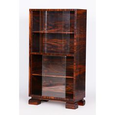 a wooden bookcase with glass doors on the front and bottom shelves inlayed to each other