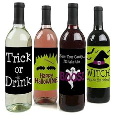 three wine bottles with halloween labels on them