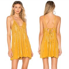 Free People Here She Is Embellished Slip Dress Nwt This Dress Is A Free People Sample It Is Not As Yellow As The Stock Photo Looks Gold In Person Evoking Flapper-Chic Vibes, This Alluring Slip Dress From Free People Is Adorned With Shimmering Sequins And Plunging Details. Short Length; A-Line Silhouette V-Neckline With Horizontal Strap; Back Tie Closure Allover Sequins; Open Back Unlined Rayon Hand Wash Imported Bust- 33" Length- 27" Tradesmodeling Backless Embellished Sequin Dress For Summer, Embellished Backless Sequin Dress For Summer, Summer Backless Embellished Sequin Dress, Summer Embellished Backless Sequin Dress, Sequin Mini Dress For Summer Beach, Chic Embellished Sequin Summer Dress, Summer Vacation Mini Dress With Sequins, Backless Sequined Mini Dress For Beach, Beach Embellished Mini Dress