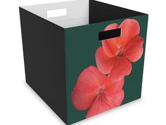 a black box with two red flowers on it