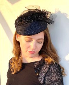 If you are looking for a black wedding hat  consider buying this one of a kind handmade piece . The base is covered with a chic fabric and black lacey tulle and the yet hat is very light. Attaches to the head with an easy to wear elastic that sits under the hair in the back. Similar hats can be found in our store in several colors. Contact me if u need help. For a larger selection:  https://www.etsy.com/il-en/shop/RanaHats?ref=simple-shop-header-name&listing_id=1359859956§ion_id=1&page=2#items R Hat For Wedding, Mother Of The Bride Hats, Black And White Hats, Dressy Hats, Occasion Hats, Church Hat, Bride Hat, Bridal Hat, Wedding Hat