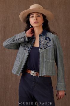 INDUSTRIAL MEETS ELEGANT. Talk about quintessential cowgirl style! This beauty is an elevated spin on a classic denim jacket, crafted from a stonewashed indigo in a sleek zip-front silhouette and embellished with a appliqued indigo toebox-style stitching and cool contrasting collar. Modern yet timeless! color: denim content: 100% cotton embellishments: embroidery, contrast stitching, garment washed size: XS-2X fit: relaxed style number: C3340 collection: Chisholm Trail Lehenga Skirts, Chisholm Trail, Fall Ready To Wear, Kimono Outerwear, Fusion Wear, Mexican Fashion, Double D Ranch, Felt Cowboy Hats, Ranch Wear