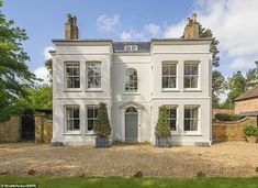 a large white house with lots of windows