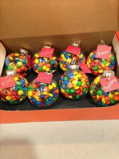 a box filled with lots of different colored candies in it's display case