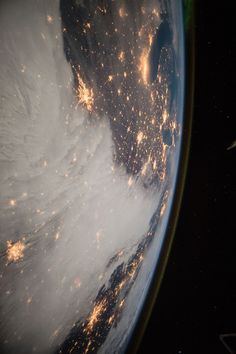 the earth's view from space shows bright lights in the clouds and on land