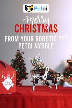 a robot dog is sitting on top of a table next to a christmas tree and presents