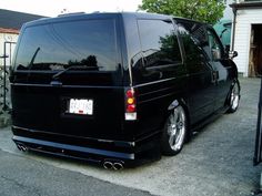 a black van parked in front of a house