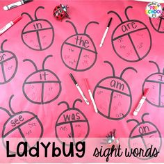 ladybug sight words are displayed on a pink background with markers and pencils