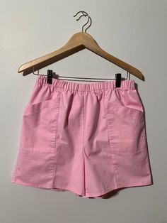 "Late 70's early 80's vintage high rise pink shorts.  No tags  Waist has elastic insert Small faint mark on right side pocket as per last pic  See measurements for sizing all measurements are taken while item is laying flat  Waist 15\" Inseam 5\" Pit seam 15.5\" Any questions just ask!  Shipping is included in purchase price.  Vintage item, regular wear due to age should be expected.  Any known flaws/marking will be listed. No returns / exchanges but please advise if there is an issue with your Vintage Beachwear, Pale Yellow Dresses, Halter Sundress, Petal Sleeve, Most Beautiful Dresses, Pattern Sweater, Half Zip Pullover, Vintage Shorts, Pink Shorts