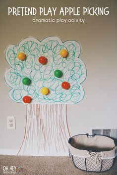 an apple tree made out of yarn with the words pretend play apples picking on it