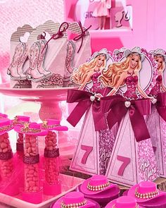 barbie birthday party with pink decorations and cupcakes