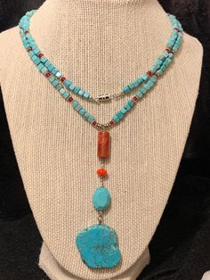 This beautiful necklace was made with square turquoise and round carnelian beads. The charm is also turquoise and carnelian and really pulls the red beautiful from the necklace. Turquoise is said to help the wearer live a life of integrity and to bring balance to our feminine or masculine traits. Bohemian Adjustable Necklace With Square Pendant, Bohemian Necklace With Adjustable Square Pendant, Bohemian Style Adjustable Necklace With Square Pendant, Bohemian Turquoise Rectangular Necklace, Turquoise Rectangular Adjustable Necklace, Adjustable Rectangular Turquoise Necklace, Masculine Traits, African Inspired Jewelry, Beaded Jewelry Necklaces