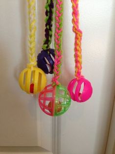 several colorful toys hanging from the side of a door