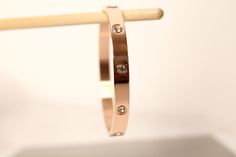 Absolutely gorgeous bracelet that adds an additional pop to your accessories. Available in plated Sliver, rose gold, and gold. One size fits most. Circumference is approximately 7.4 inches 0.27 wide thickness 2.4in inner space Rose Gold Metal Bangle For Everyday Wear, Rose Gold Metal Bangle, Trendy Rose Gold Metal Cuff Bracelet, Rose Gold Stainless Steel Bangle Bracelet, Adjustable Tarnish-resistant Rose Gold Bangle, Trendy Rose Gold Metal Bangle, Rose Gold Stainless Steel Bangle Cuff Bracelet, Rose Gold Metal Cuff Bracelet As Gift, Modern Rose Gold Tarnish-resistant Cuff Bracelet