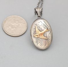 "A sterling silver picture locket featuring a stunning spider on the front. This gothic style necklace is an oval locket with a working compass inside and a place for your favorite photo. Instead of a photo you could take it to a jeweler and have something engraved on the inside. A mini working brass compass with glass top is set in an antiqued sterling silver crown edge bezel. The working compass is set inside a .925 sterling silver locket. On the front of the sterling silver locket necklace is Locket For Men, Silver Bird Necklace, Sterling Silver Locket Necklace, Victorian Style Jewelry, Spider Necklace, Engraved Locket, Pendant Locket, Picture Locket, Silver Bird