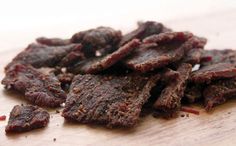 beef strips on a wooden cutting board ready to be cooked