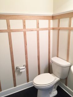 a white toilet sitting inside of a bathroom next to a sink and bathtub under construction