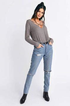 Upgrade Your Basics With The Cross My Heart Taupe Tee. This Comfortable Blouse Features Long Sleeves, A Flowy Fit, And A Criss Cross Neckline. Pair This Basic Long Sleeve Tee With Distressed Denim And Booties. Edgy Ripped Tops For Fall, Chic Distressed Tops For Fall, Trendy Long Sleeve Distressed Tops, Comfortable Blouses, Basic Long Sleeve Tee, Criss Cross Top, Model Profiles, Cross Top, Heart Tee