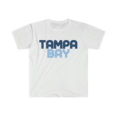 Tampa Bay Rays fans - this was designed with you in mind! Tampa Bay Rays Retro Tee, Vintage Rays Inspired Baseball Shirt printed on Gildan 64000. The unisex soft-style t-shirt puts a new spin on casual comfort. Made from very soft materials, this tee is 100% cotton for solid colors. Heather colors and sports grey include polyester.  The collar is made with ribbed knitting to prevent curling damage.  .: 100% ring-spun cotton (fiber content may vary for different colors) .: Light fabric (4.5 oz/yd² (153 g/m .: Eurofit .: Tear-away label .: Runs true to size Graphic Tee With Logo Print For Fan Merchandise, Graphic Tee Shirt With Logo Print For Fans, Relaxed Fit T-shirt With Screen Print For Fan Gear, Relaxed Fit T-shirt With Screen Print For Fans, Graphic Tee T-shirt With Text Print For Fans, Graphic Tee With Text Print For Fan Gear, Graphic Tee With Text Print For Fan Merchandise, Pre-shrunk Graphic Tee For Fan Gear, Fan Apparel Shirt With Letter Print For Fan Merchandise