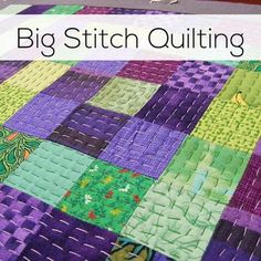 a close up of a quilt with the words big stitch quilting on it