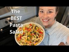 a woman holding a bowl of food in front of her face with the words ranch pasta salad