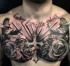 chest tattoo with cross and roses on it