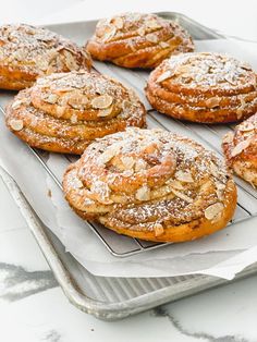 several pastries sitting on top of a cooling rack