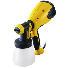 a yellow and black blow dryer sitting on top of a white cup