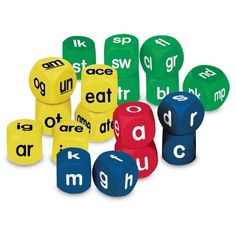 several different colored dices with letters and numbers on them that spell out the words