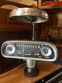 an old radio sitting on top of a wooden table