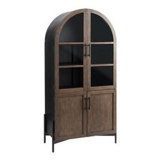 an arched wooden cabinet with glass doors