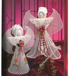 two crocheted angel figurines are on display