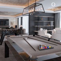 a pool table in a living room next to a couch and coffee table with balls on it