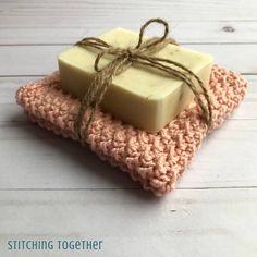 a crocheted dishcloth with two soap bars tied up to it and the words free washcloth crochet pattern