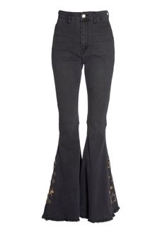 Badass tendencies! You and these babies are meant to be! With a high rise and dramatic flare, these stretch bell bottoms make your legs look a mile long with retro-inspired style that feels cool and modern! The flare pants come in black denim and feature a gold star design that rounds up the `70s swagger of these bells. The vintage-inspired bell bottom jeans feature a zip fly closure, pockets at back and a raw hem. Flirty flare features a slender fit through hip and thigh with a dramatic flared Trendy Full-length Flares For Fall, Trendy Full-length Fall Flares, Trendy Full Length Flares For Fall, Trendy Full Length Fall Flares, Stretch Flare Jeans For Night Out, Black Flared Hem Pants For Party, Fall Wide Leg Pants For Concert, Wide Leg Pants For Fall Concert, Black Stretch Flare Jeans For Night Out