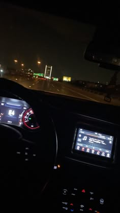 the dashboard of a car at night time