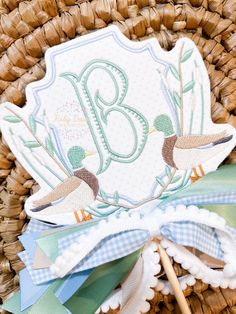 a close up of a basket with some type of decoration on it and a stick