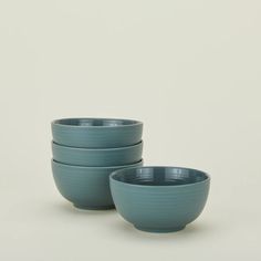 three blue bowls sitting on top of each other