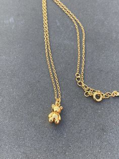 This charming pendant necklace features a lovable teddy bear charm plated with 14K gold on sterling silver 925. The pendant hangs from a delicate chain, perfect for adding a touch of whimsy to any outfit. The brand, Angel A, is known for its high-quality jewelry and this piece is no exception. The pendant is designed in the style of a charm, making it an ideal addition to any collection or a thoughtful gift for a loved one.  Add this adorable teddy bear charm pendant necklace to your collection Wedding Daughter, Charm Making, Charm Pendant Necklace, Delicate Chain, Birthday Gift For Her, Christmas Wedding, Birthday Gifts For Her, High Quality Jewelry, Gold Plated Sterling Silver