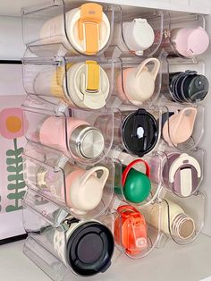 an organized plastic container with cups and lids