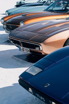 a row of old cars parked next to each other